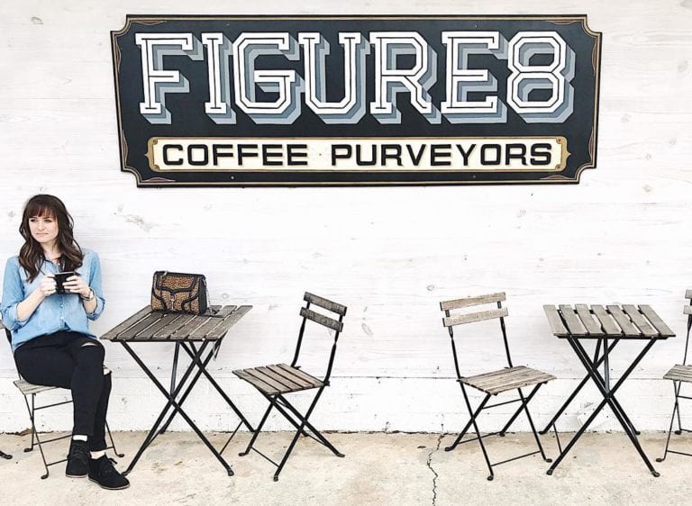 girl sitting outside Figure 8 Coffee in Austin