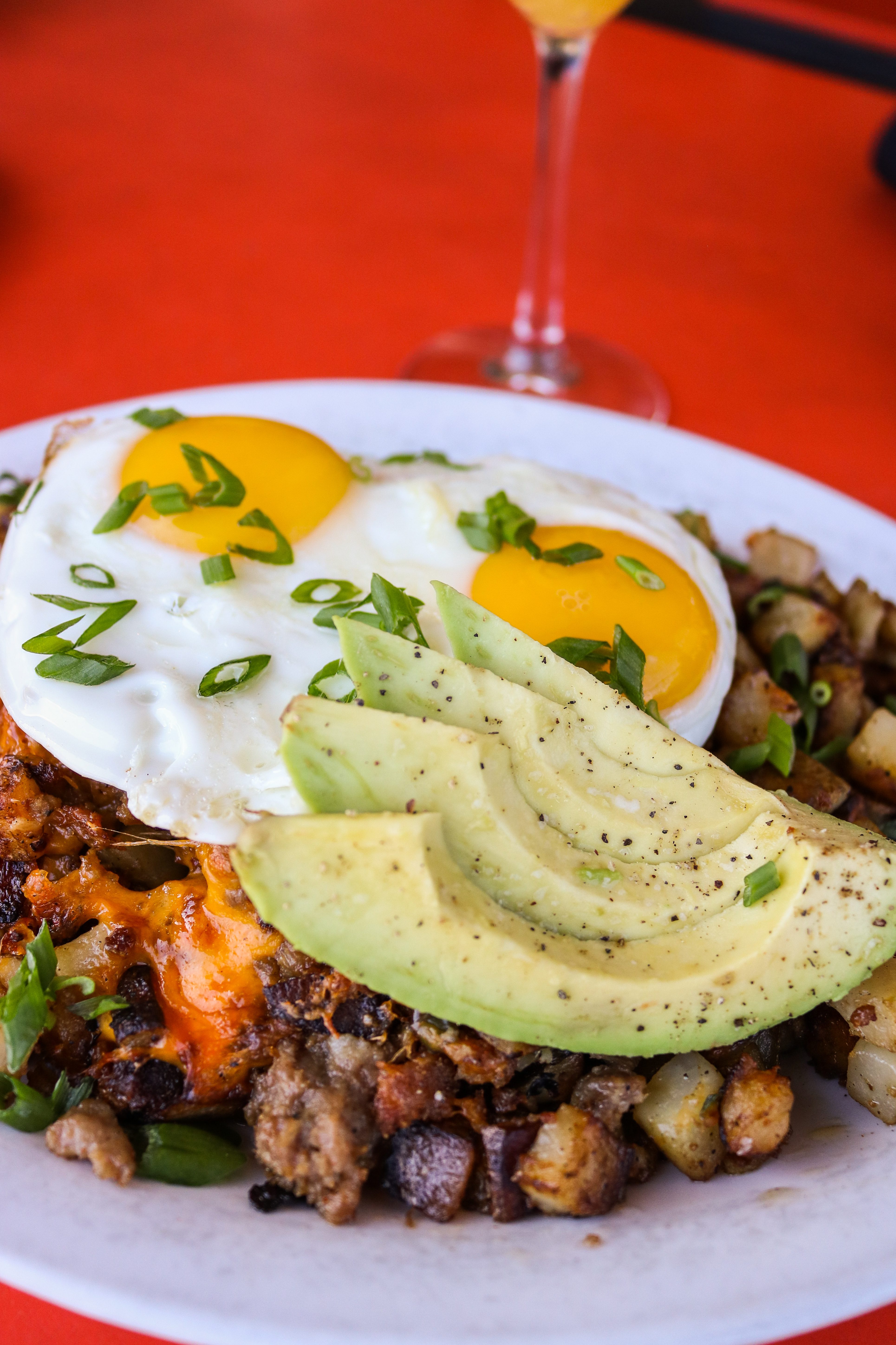 hash with avocado and eggs at 24 diner